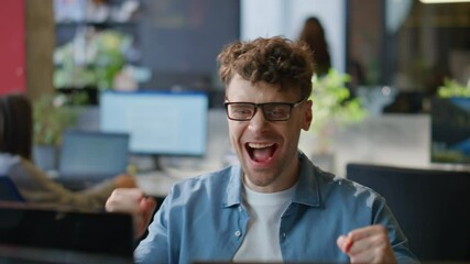 Poster - Joyful employee celebrating promotion email in office closeup. Happy man winner