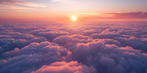 Poster - A peaceful aerial perspective of the sunrise over a wide stretch of billowy clouds