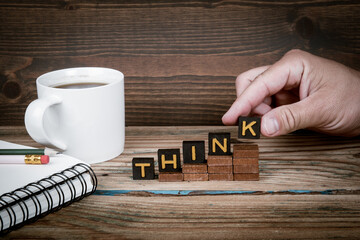Wall Mural - think. old letter tiles on wooden steps, development concept