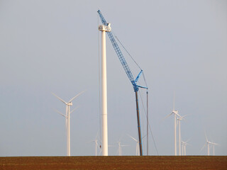 Wind turbine under construction with crane