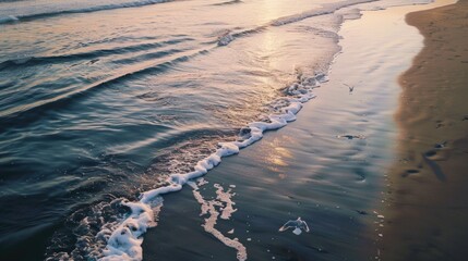 Poster - A serene view of the ocean at sunset from a peaceful beach, perfect for relaxation or inspiration