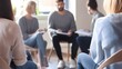 © Felippe Lopes - Group of people sitting in a circle during a meeting or support group.