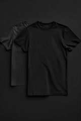 Aufkleber - Close-up of two black T-shirts on a dark background, great for minimalist fashion or abstract art designs