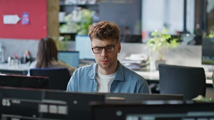 Poster - Frowning guy looking monitor at corporate office closeup. Businessman working