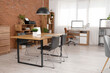 © Pixel-Shot - Interior of modern open space office with workplaces, chairs and shelving unit