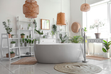 Wall Mural - Bathtub, shelving units, chest of drawers and different houseplants in modern light bathroom