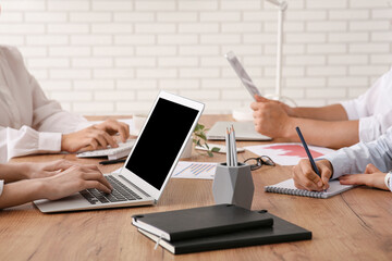 Canvas Print - Business team with laptop during meeting in office, closeup