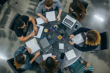 Poster - In a modern office setting, a collaborative team meeting is seen from a topdown view, showcasing teamwork, discussion, productivity, creativity, and engagement among professionals