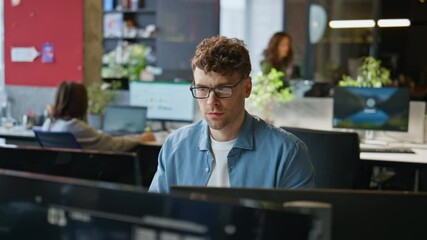 Poster - Serious man looking monitor at corporate office closeup. Guy employee working
