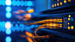 © easybanana - A computer server with many cables and lights. The server is blue and orange