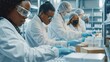 © McClerish - Lab workers in white coats package products in a sterile environment.