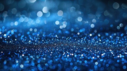 Wall Mural - A mesmerizing blue glittering sparkle background with bokeh lights, perfect for festive and celebratory themes.