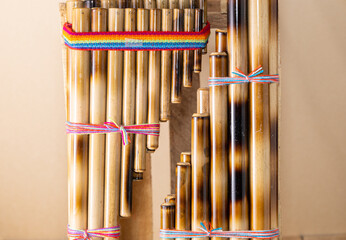 Panpipes on beige background isolated. Zampoña. Andean Instruments. South American instruments. Wind instruments. Pan flute.