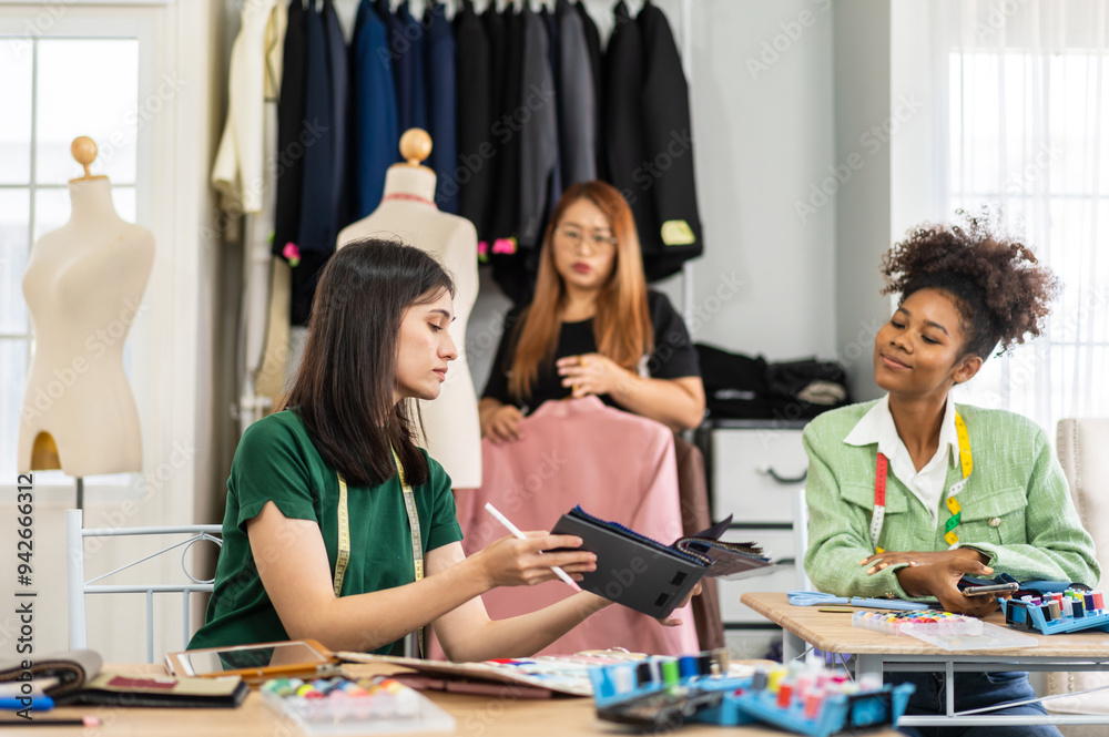 Collaboration and creativity in fashion design of teamwork, three diverse and talented designer collaborating on fabric swatches and design choices, creative studio, textile industry, fabric selection