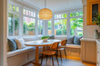© toha - Cozy Kitchen Nook with Window Seating and Pendant Light - Interior Design Photo