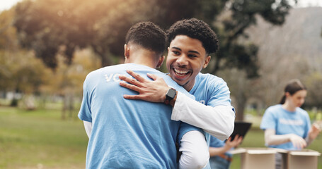 Men, volunteer and people hug in park together for solidarity, support or sustainability at green ngo. Gratitude, nature and friends in embrace for teamwork, community care or social responsibility