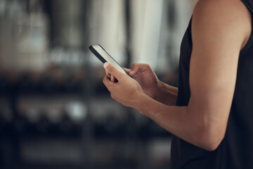 Canvas Print - Fitness, hands and person with phone at gym for tracking workout progress, exercise app and reading notification. Athlete, space and smartphone at sports club for training website and wellness tips