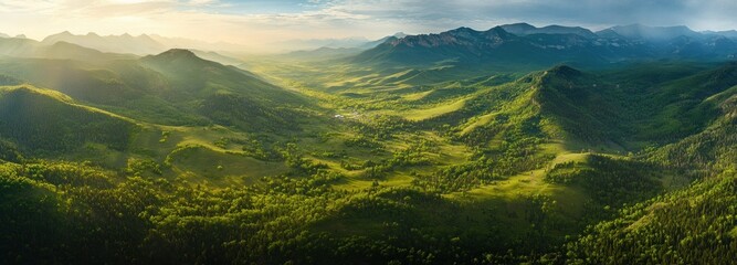 Wall Mural - Aerial View of Lush Green Mountain Valley at Sunset