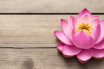 Lotus flower over a wooden background with a copy space