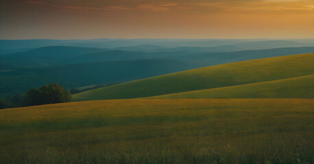 Beautiful landscape of green hills bathing in the light of the setting sun