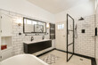 © ADDICTIVE STOCK - Modern bathroom with elegant black and white design