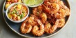 © jambulart - Coconut shrimp with fruit salad and lime wedges.