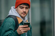 © carballo - young man with mobile phone on the street