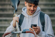 © carballo - student with mobile phone carrying the bicycle