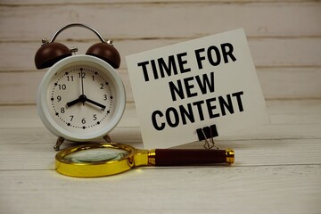 Aufkleber - Time For New Content text on paper card with alarm clock and magnifying glass on wooden background