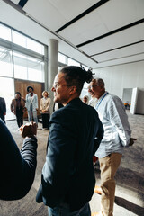 Wall Mural - professional male with dreadlocks attending business conference and networking