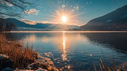 A beautiful lake with a sun shining on the water