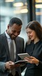 © Lu - Joyful Corporate Collaboration: Diverse Business Team Laughing Over Tablet. Modern Office Culture Showcasing Inclusivity, Teamwork, and Technology Integration. Elegant Minimalist Design for Marketing