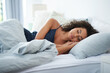 © Chanelle2000/peopleimages.com - Woman, sleeping and relax in bedroom for zen, calm and home for recovery on weekend morning. Female person, pillow and bed for resting in apartment, dream nap and comfortable fatigue for wellness