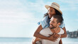 © Chanelle2000/peopleimages.com - Love, bonding and piggyback with interracial couple, beach view and relationship for anniversary on holiday together. Romance, man and woman with ocean, summer mockup and space with sunset vacation