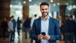 © CStock - A successful-looking male professional holding a smartphone,