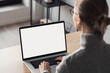 © kite_rin - Woman working at home office, Student girl using laptop computer with blank empty screen, work or studying from home, freelance, online learning, distance education concept