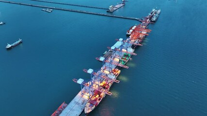 Wall Mural - crane loading cargo container from truck to container ship in the international terminal logistic sea port concept freight shipping by ship. industry transportaion