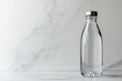 © Anton - Minimalist clear water bottle on white marble