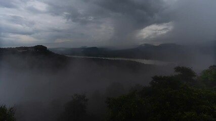 Aufkleber - Misty morning landscape with a vibrant rainbow arching over the fog-shrouded river, Phatam National Park, Ubonratchathani