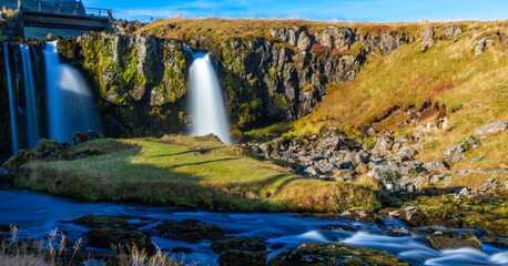 A beautiful waterfall with a river flowing underneath it. Silk effect.