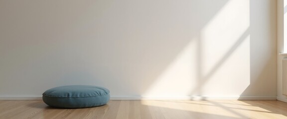 Minimalist room with serene atmosphere featuring blue cushion against white wall with copy space