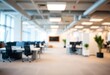 © Dzikrul Husnani - Beautiful blurred background of a light modern office interior with panoramic windows and beautiful lighting, ai