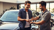 © ZOHAIB - Man receiving keys to his new car from a dealer symbolizing ownership