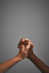 Poster - Hands, holding and studio for support or unity, together and symbol of solidarity on gray background. People, fingers join and love for partnership or compassion, respect and trust on mockup space