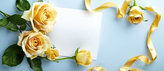 Poster - Blue background with white card decorated with yellow roses and ribbon offers copy space image