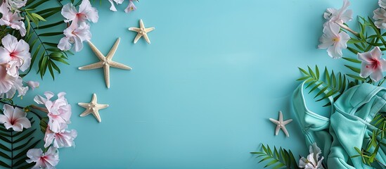 Aufkleber - Beautiful swimsuit flowers and starfish arranged on a light blue background in a flat lay composition with copy space image