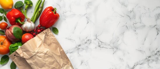 Poster - Fresh fruits and vegetables in a paper bag showcased on a white marble backdrop in a flat lay style perfect for adding text to the copy space image