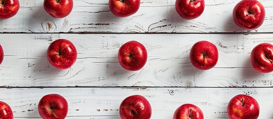 Aufkleber - Red apples arranged on a white wooden surface in a flat lay style offering ample copy space for inserting text in the image