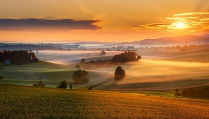 Wall Mural - majestic foggy sunrise over colorful farmland and countryside