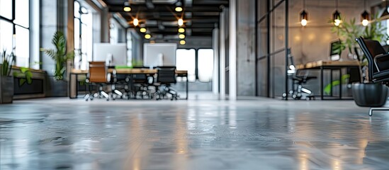 Aufkleber - Empty contemporary office interior with bokeh background featuring furniture computers and a sleek concrete floor ideal for a copy space image